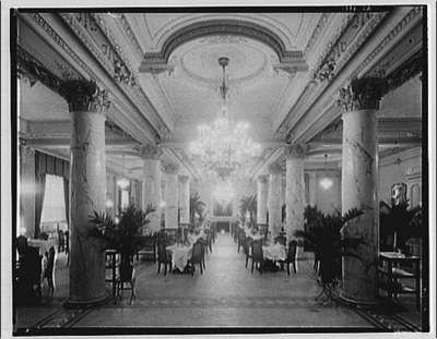 Dining area in Raleigh Hotel, with columns and chandelier