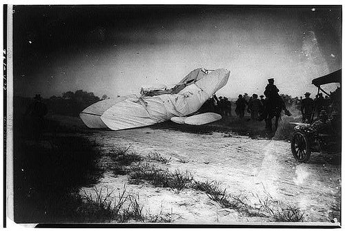 collapsed Wright airplane photographed just after it struck the ground